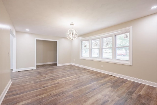 162 Berkshire Dr, Greece, NY 14626 - empty room with a chandelier, wood finished floors, baseboards, and recessed lighting