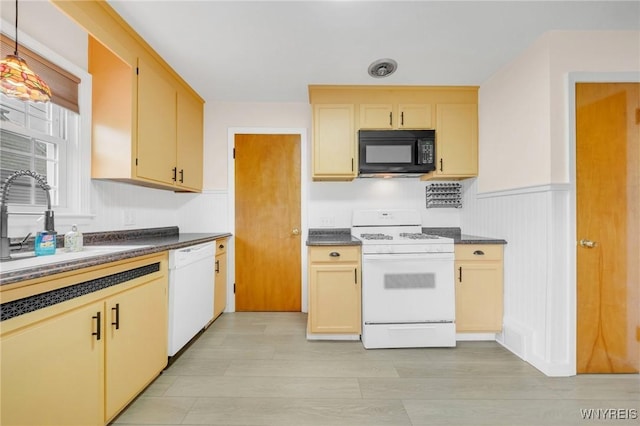 470 Windermere Blvd, Amherst, NY 14226 - kitchen with white appliances, dark countertops, a sink, and wainscoting