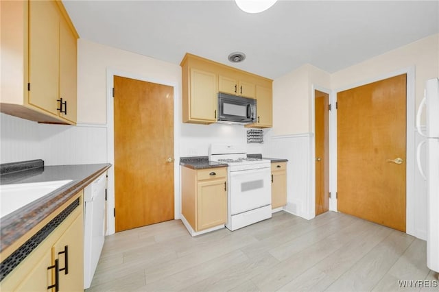 470 Windermere Blvd, Amherst, NY 14226 - kitchen with white appliances, dark countertops, a wainscoted wall, and light wood-style flooring