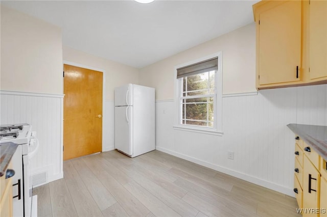470 Windermere Blvd, Amherst, NY 14226 - kitchen with white appliances, light wood-type flooring, wainscoting, and baseboards