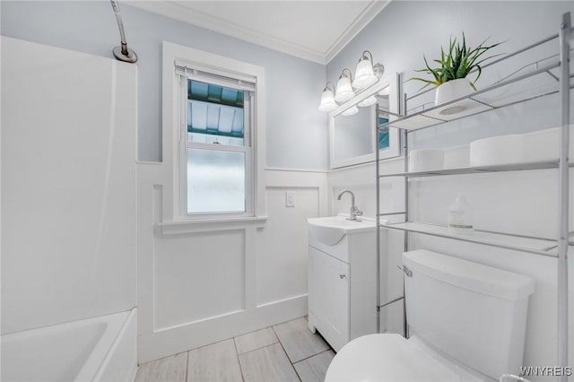 470 Windermere Blvd, Amherst, NY 14226 - bathroom featuring vanity, toilet, crown molding, a wainscoted wall, and bathing tub / shower combination