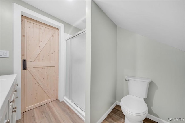 470 Windermere Blvd, Amherst, NY 14226 - bathroom with wood finished floors, a stall shower, toilet, and vanity