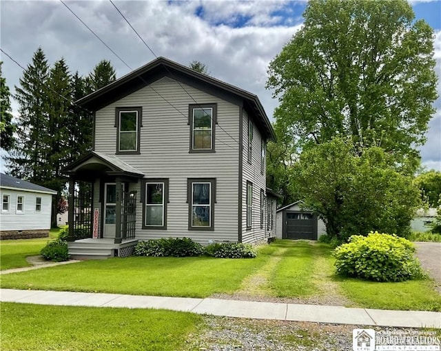 28 N Washington St, Randolph, NY 14772 - view of front facade featuring driveway, a front lawn, an outdoor structure, and a garage