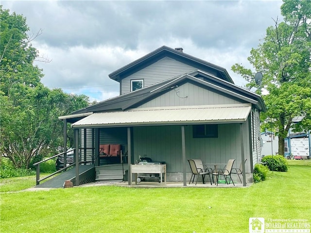 28 N Washington St, Randolph, NY 14772 - rear view of house with a lawn