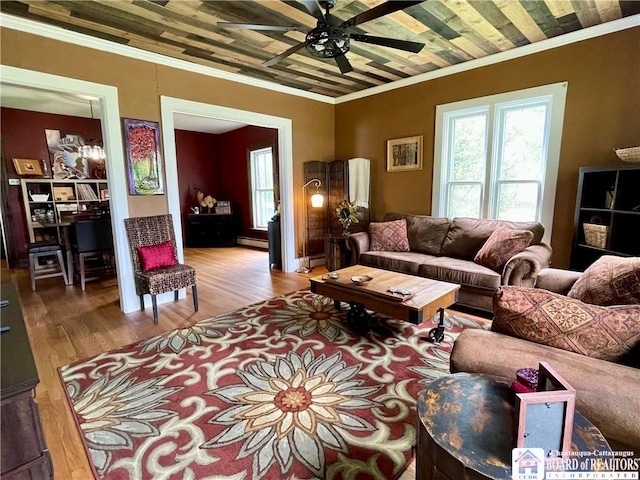 28 N Washington St, Randolph, NY 14772 - living area featuring crown molding, a ceiling fan, a baseboard heating unit, and wood finished floors