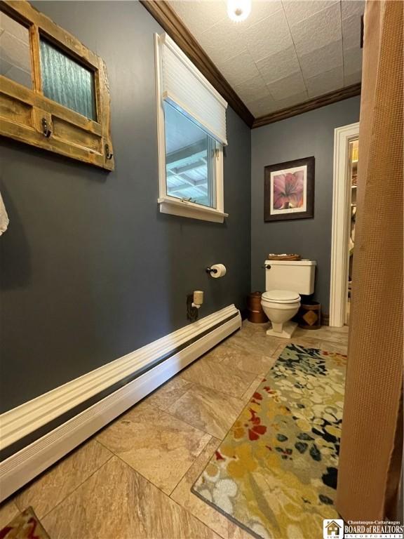 28 N Washington St, Randolph, NY 14772 - half bathroom with toilet, a baseboard radiator, crown molding, and baseboards