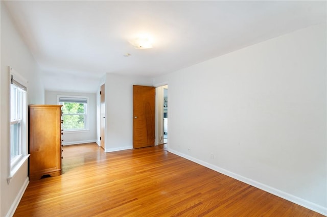 156 Rossiter Rd, Rochester, NY 14620 - empty room with light wood-style flooring and baseboards