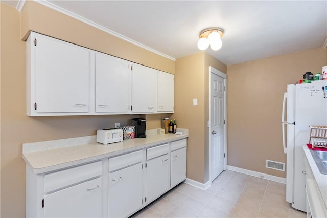 156 Rossiter Rd, Rochester, NY 14620 - kitchen with freestanding refrigerator, white cabinetry, light countertops, and baseboards