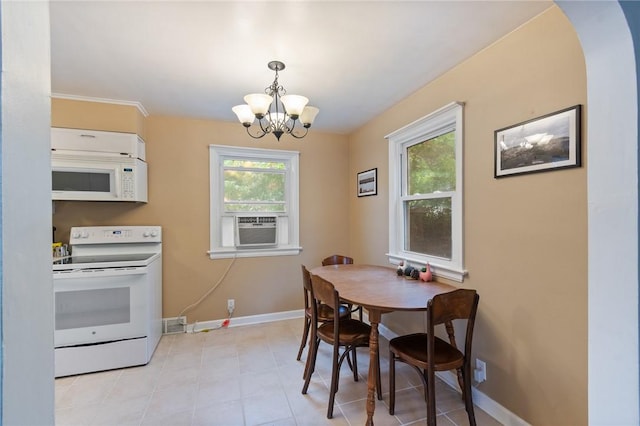 156 Rossiter Rd, Rochester, NY 14620 - dining area featuring a chandelier, baseboards, arched walkways, and cooling unit