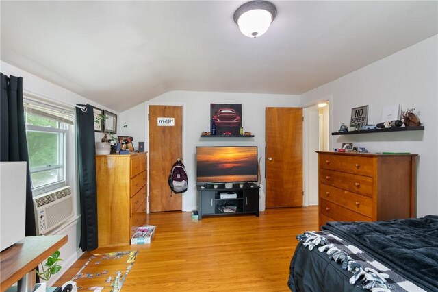 156 Rossiter Rd, Rochester, NY 14620 - bedroom with light wood-style flooring, lofted ceiling, and cooling unit