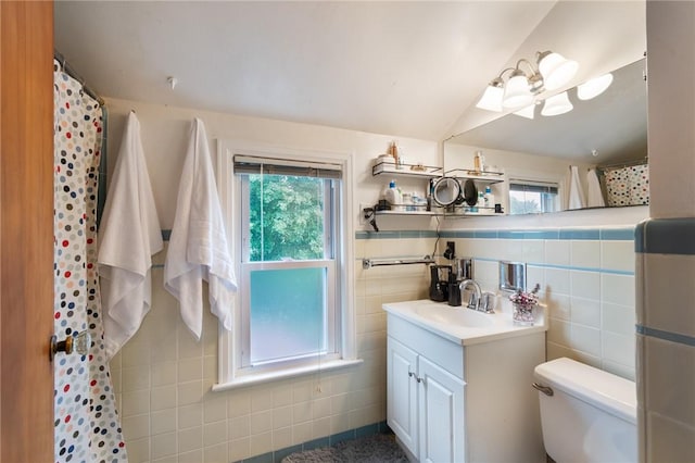 156 Rossiter Rd, Rochester, NY 14620 - bathroom with vanity, toilet, tile walls, plenty of natural light, and a shower with curtain