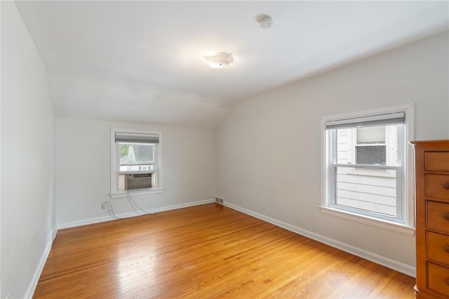 156 Rossiter Rd, Rochester, NY 14620 - additional living space featuring lofted ceiling, light wood finished floors, cooling unit, and baseboards