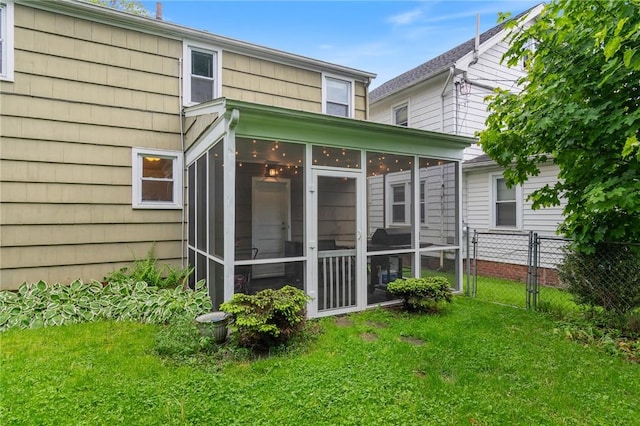 156 Rossiter Rd, Rochester, NY 14620 - rear view of house with a sunroom