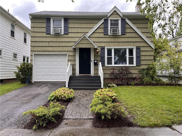 156 Rossiter Rd, Rochester, NY 14620 - view of front of home featuring a chimney, asphalt driveway, a front lawn, and an attached garage