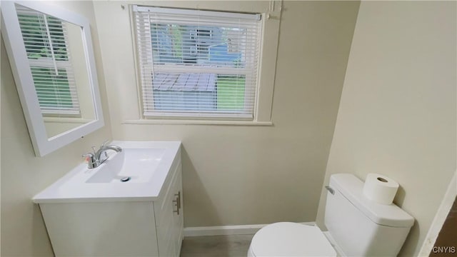 267 Fenway Dr, Syracuse, NY 13224 - bathroom with toilet, vanity, and baseboards