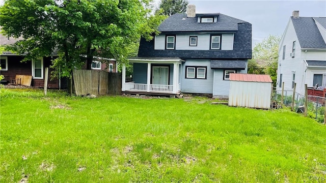 267 Fenway Dr, Syracuse, NY 13224 - back of property featuring roof with shingles and a porch