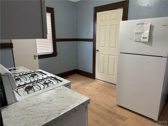 267 Fenway Dr, Syracuse, NY 13224 - kitchen featuring white appliances, light wood-style floors, and light countertops