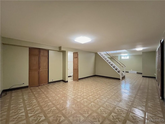 40 River Oaks Dr, Grand Island, NY 14072 - basement with stairs, baseboards, and light flooring
