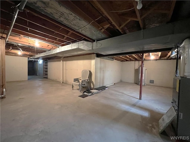 40 River Oaks Dr, Grand Island, NY 14072 - unfinished basement featuring water heater and stairway