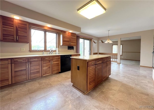 40 River Oaks Dr, Grand Island, NY 14072 - kitchen featuring dishwasher, light countertops, a kitchen island, and brown cabinetry