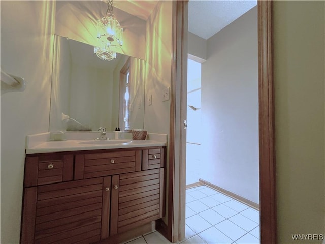 40 River Oaks Dr, Grand Island, NY 14072 - bathroom featuring tile patterned flooring, vanity, and a chandelier