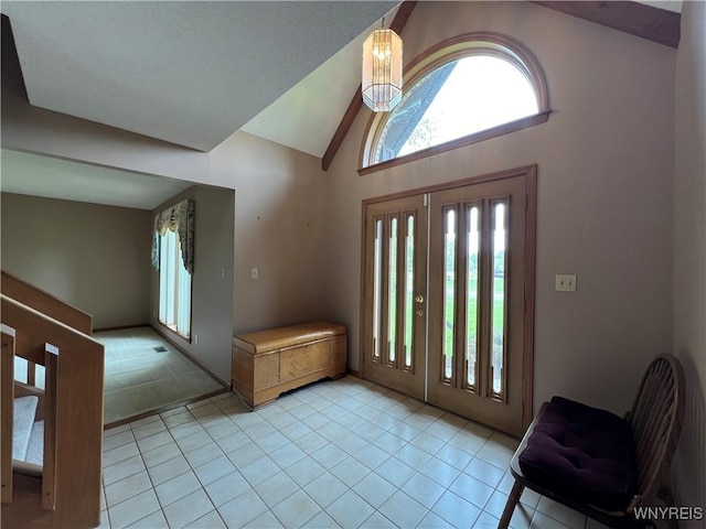 40 River Oaks Dr, Grand Island, NY 14072 - entryway featuring healthy amount of natural light, light tile patterned flooring, and high vaulted ceiling