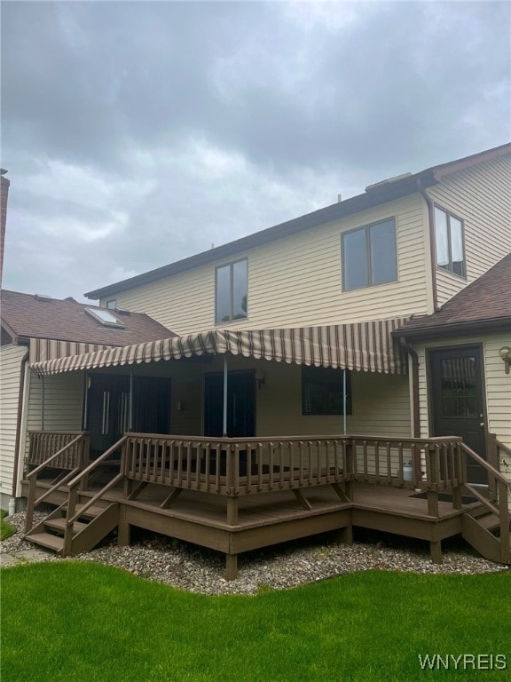 40 River Oaks Dr, Grand Island, NY 14072 - rear view of house with a wooden deck and a lawn
