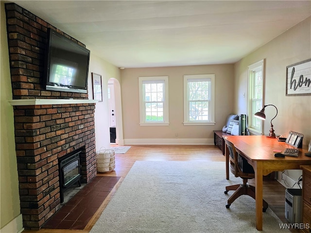 3666 S Hill Rd, Hamburg, NY 14075 - home office featuring a brick fireplace and baseboards
