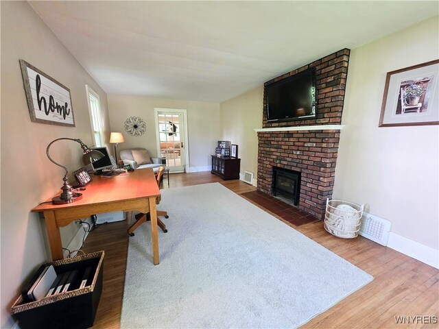 3666 S Hill Rd, Hamburg, NY 14075 - office with wood finished floors, a fireplace, and baseboards