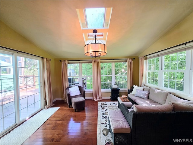 3666 S Hill Rd, Hamburg, NY 14075 - living area with vaulted ceiling, healthy amount of natural light, wood finished floors, and a chandelier