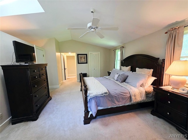 3666 S Hill Rd, Hamburg, NY 14075 - bedroom with lofted ceiling, light carpet, a ceiling fan, baseboards, and a skylight