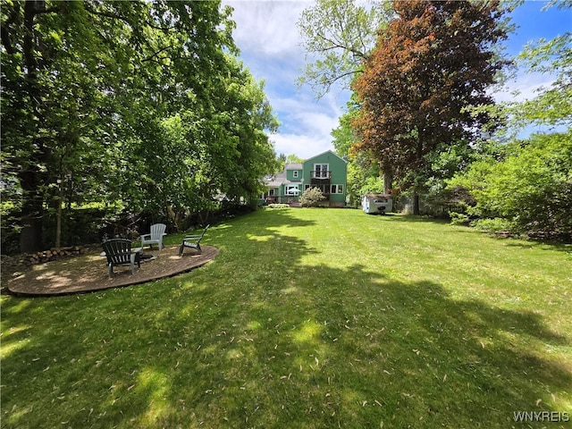 3666 S Hill Rd, Hamburg, NY 14075 - view of green lawn with a patio area