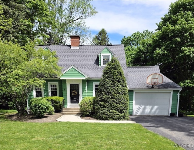 3666 S Hill Rd, Hamburg, NY 14075 - cape cod home featuring a front yard, asphalt driveway, a chimney, and roof with shingles