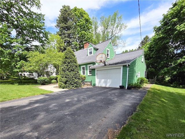 3666 S Hill Rd, Hamburg, NY 14075 - view of front of property featuring driveway, a garage, a front yard, a shingled roof, and a chimney