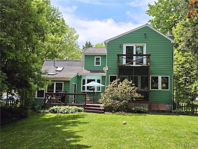 3666 S Hill Rd, Hamburg, NY 14075 - back of house featuring a deck, a lawn, and roof with shingles