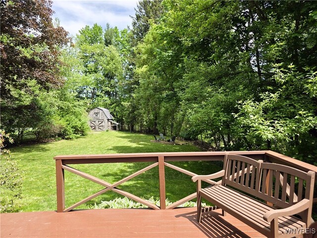 3666 S Hill Rd, Hamburg, NY 14075 - wooden terrace with a barn, an outdoor structure, and view of scattered trees