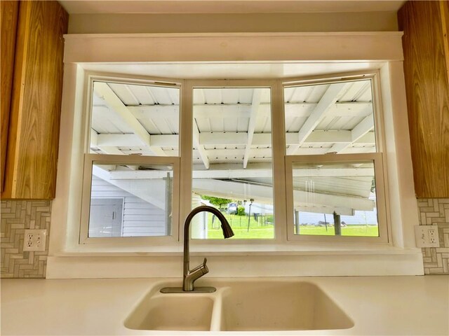 113 1st St, Shinglehouse, PA 16748 - kitchen view of a sink, backsplash, and light countertops