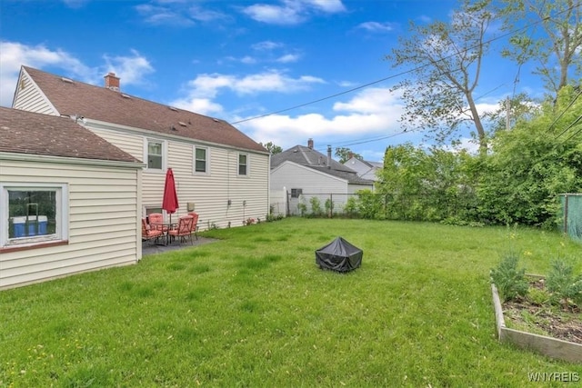 224 Dalton Dr, Tonawanda-Town, NY 14223 - rear view of property with a vegetable garden