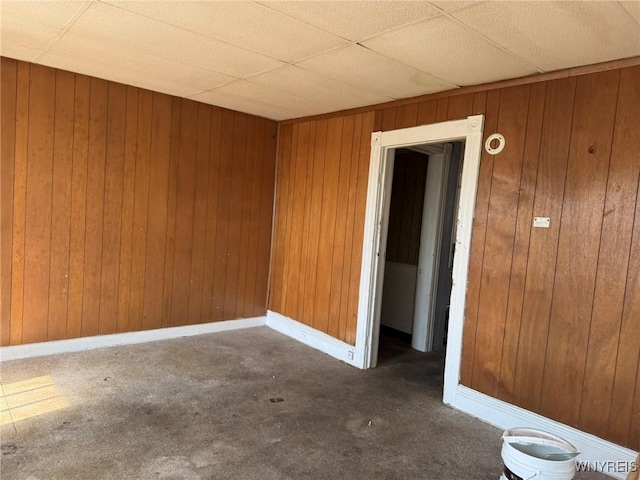 1306 E Lovejoy St, Buffalo, NY 14206 - spare room with carpet flooring, wooden walls, and baseboards