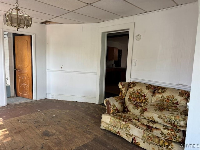 1306 E Lovejoy St, Buffalo, NY 14206 - living area featuring hardwood / wood-style flooring, a paneled ceiling, and a chandelier