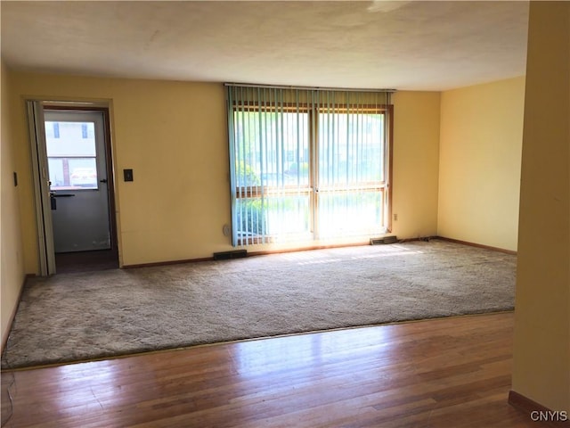 7742 Davis Rd S, Clay, NY 13212 - empty room with baseboards and wood finished floors