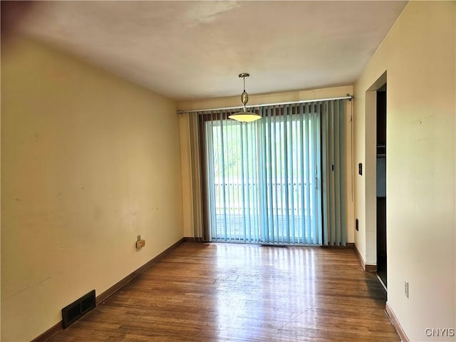 7742 Davis Rd S, Clay, NY 13212 - spare room featuring wood finished floors and baseboards