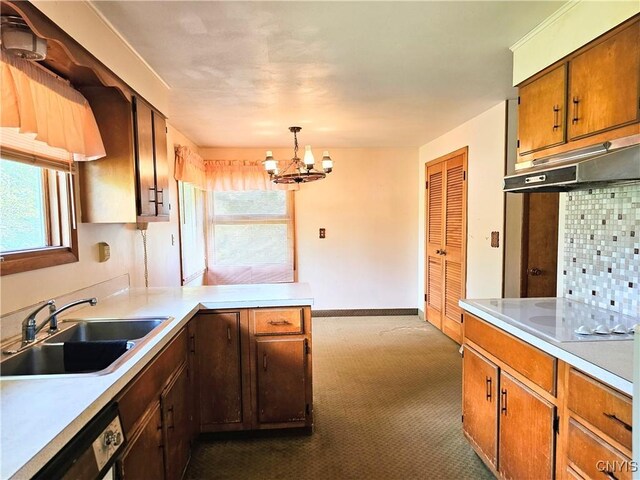 7742 Davis Rd S, Clay, NY 13212 - kitchen with a sink, white electric stovetop, light countertops, and dark colored carpet