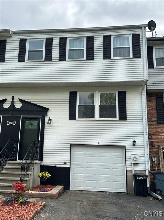 8408A Shallowcreek Rd, Clay, NY 13090 - view of front facade featuring a garage and asphalt driveway