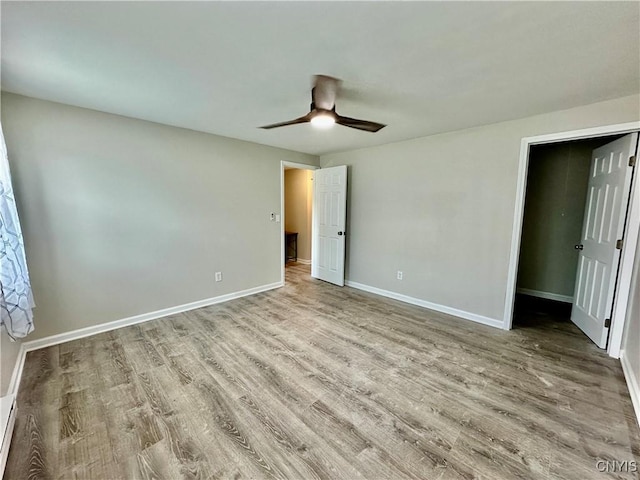 8408A Shallowcreek Rd, Clay, NY 13090 - unfurnished bedroom with wood finished floors, baseboards, and ceiling fan