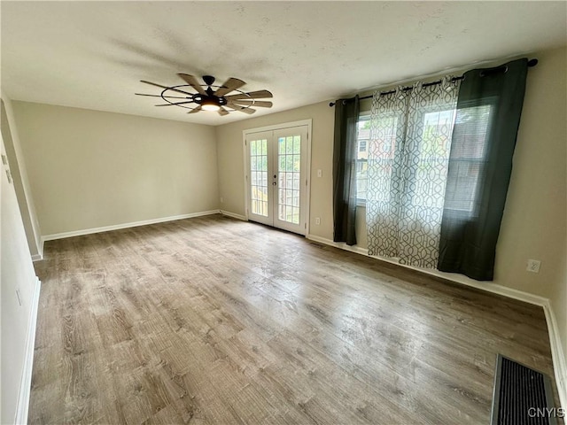 8408A Shallowcreek Rd, Clay, NY 13090 - unfurnished room with ceiling fan, french doors, and wood finished floors
