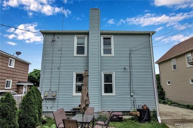 202 Tremaine Ave, Tonawanda-Town, NY 14217 - rear view of house with a chimney