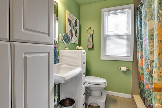 202 Tremaine Ave, Tonawanda-Town, NY 14217 - bathroom with baseboards, toilet, and a shower with curtain