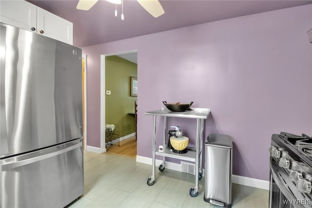 202 Tremaine Ave, Tonawanda-Town, NY 14217 - kitchen with stainless steel appliances, baseboards, ceiling fan, and white cabinets