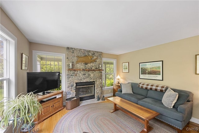 8105 Wilbarham Run, Pompey, NY 13104 - living area with a fireplace and light wood-style flooring